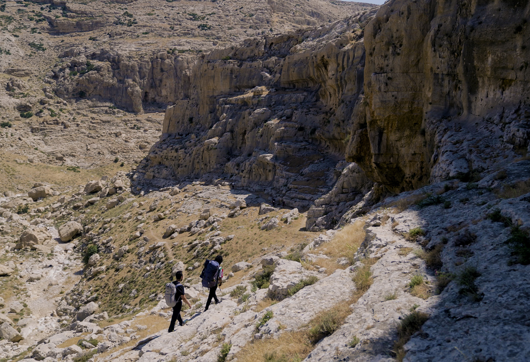 Andrew Bisharat and Urwah Askar approach the crags of Ein Fara Andrew Bisharat and Urwah Askar approach the crags of Ein Fara