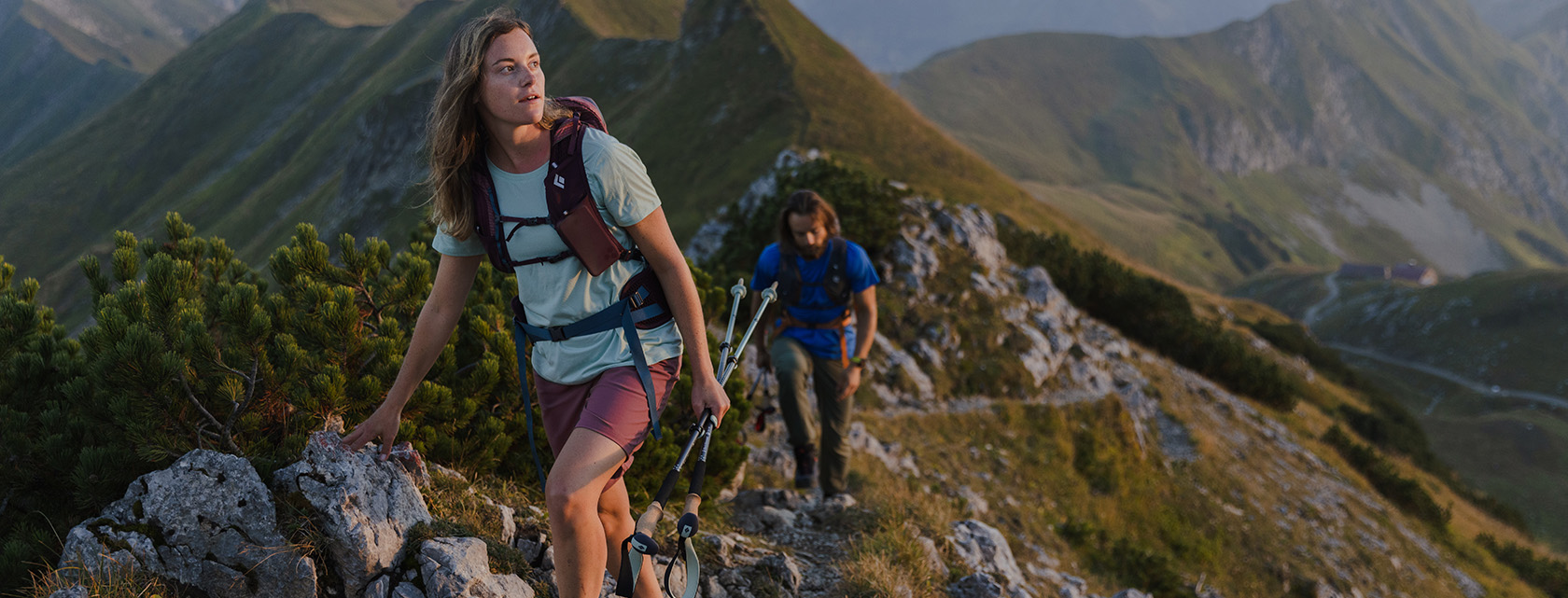 Couple hiking using Pursuit packs and trekking poles_01986 Web Banner